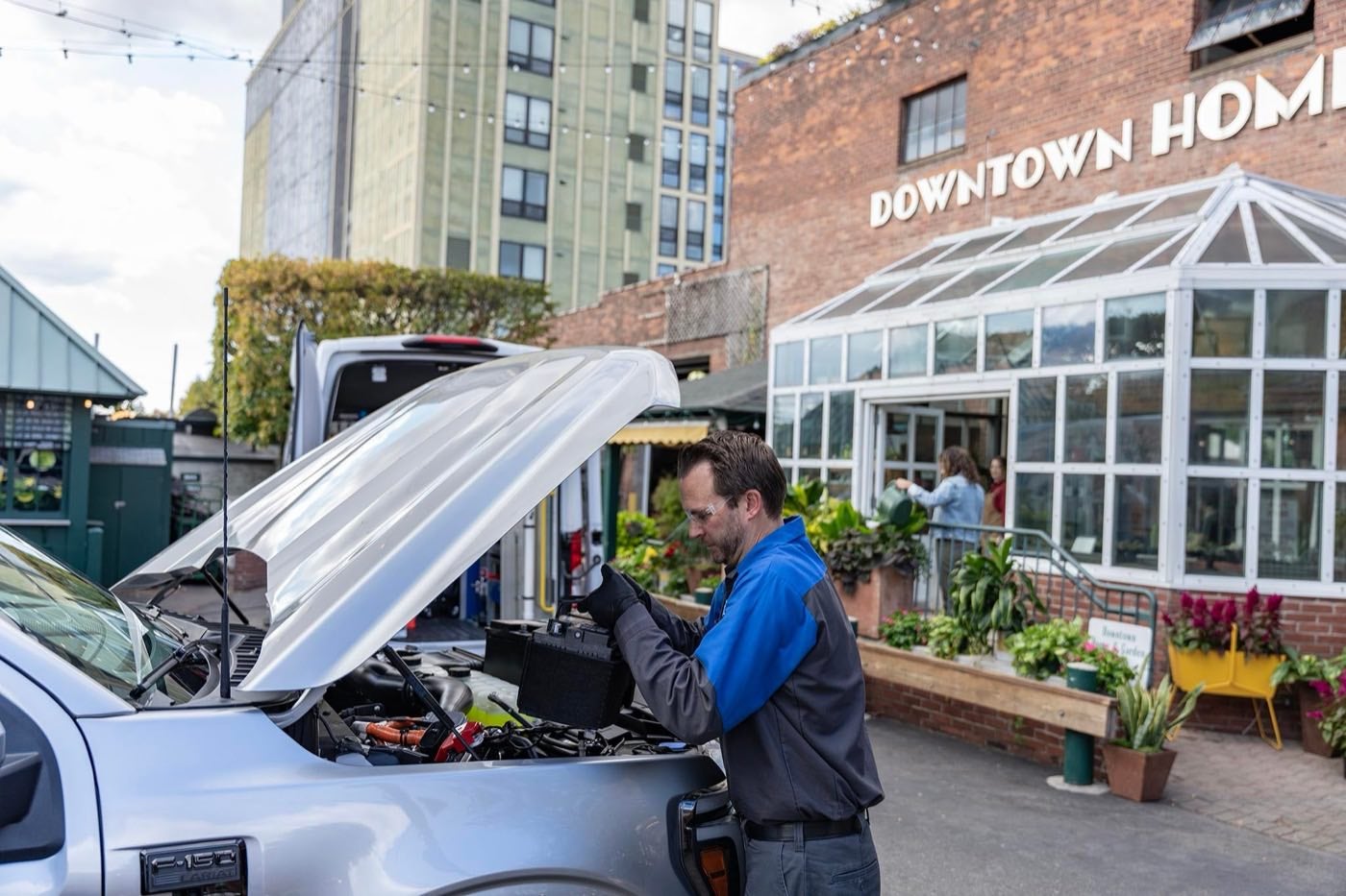 Ford Mobile Service technician replacing a vehicle battery